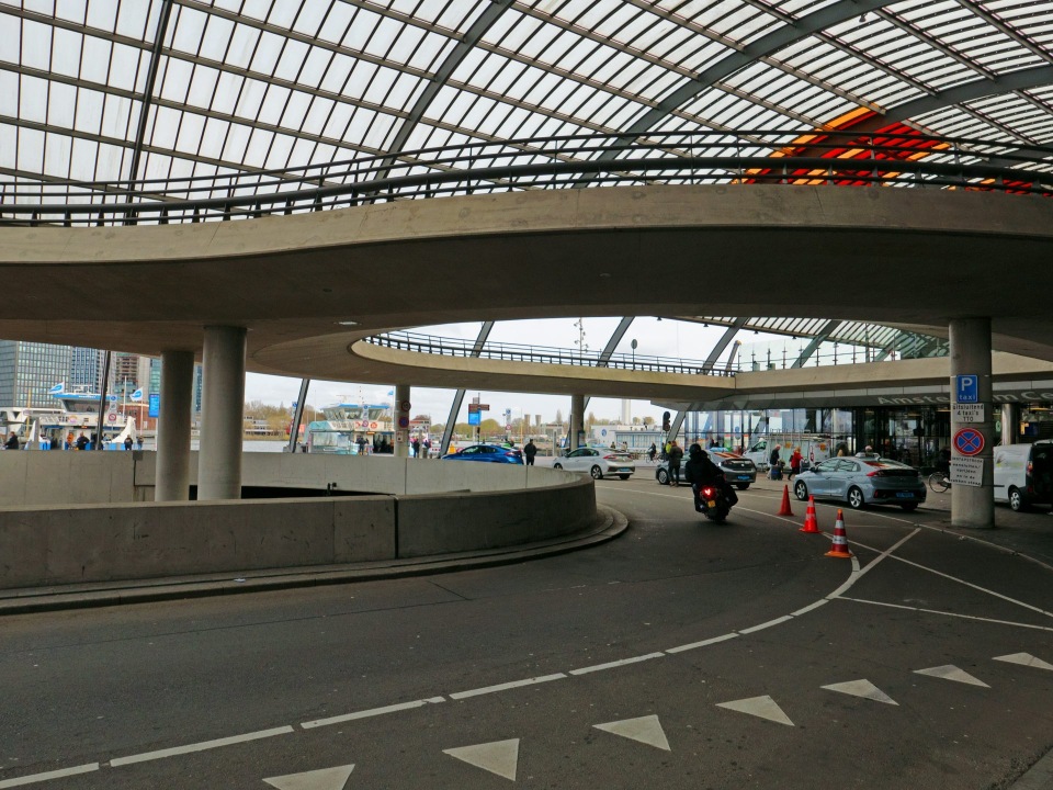 Covered walkway with cars underneath