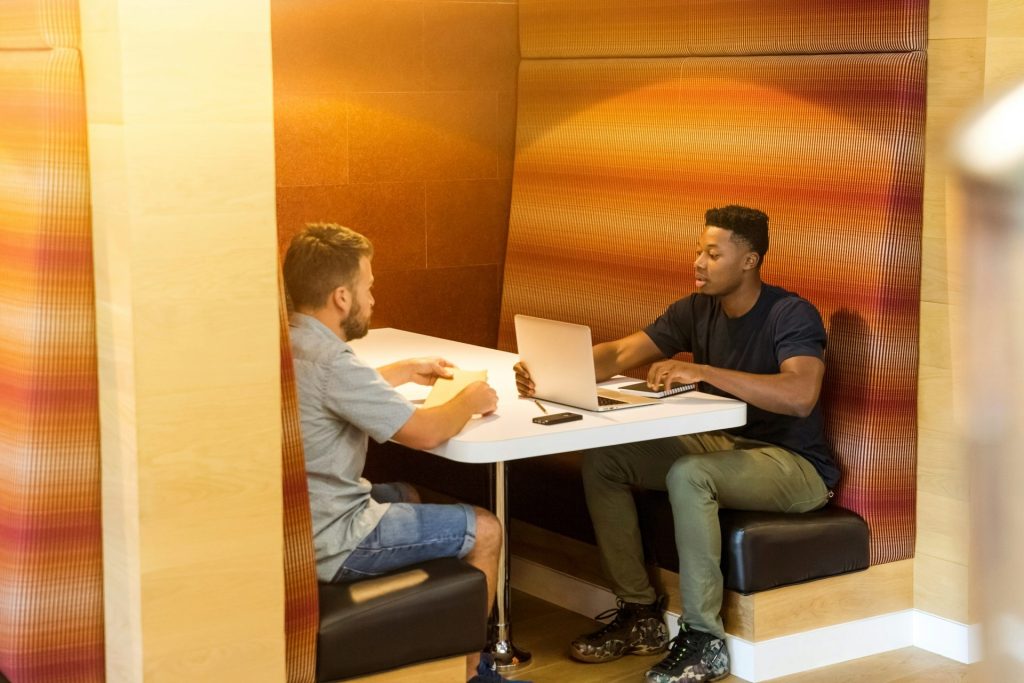 Two people in a casual business meeting