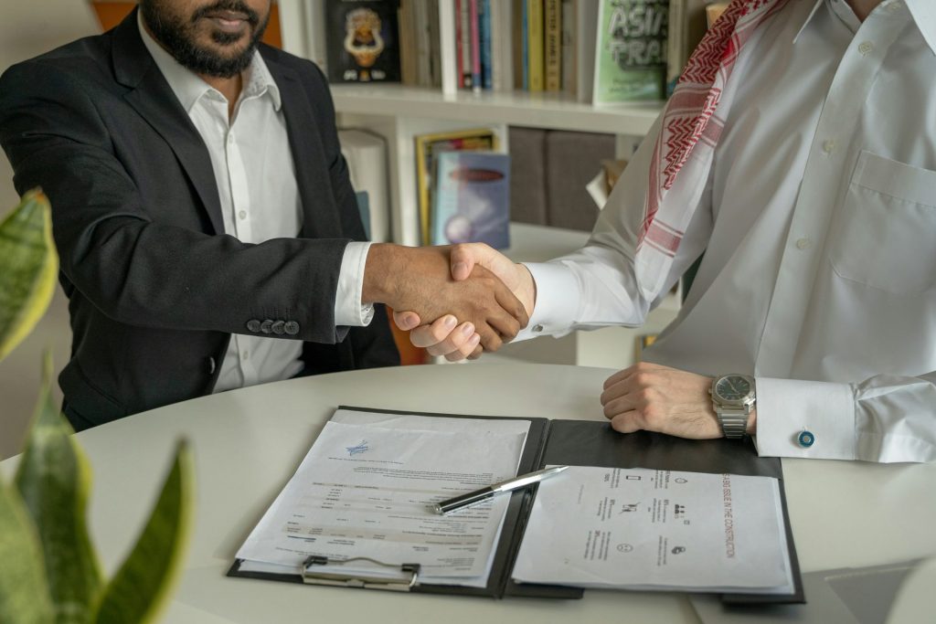 Two men shaking hands formally