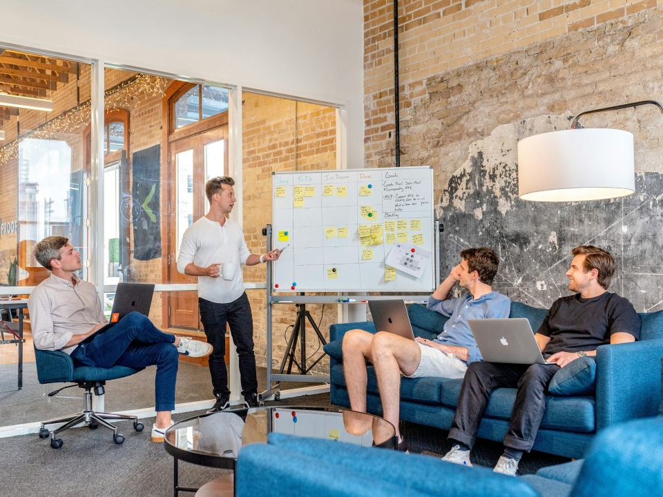 Team discussing work around whiteboard